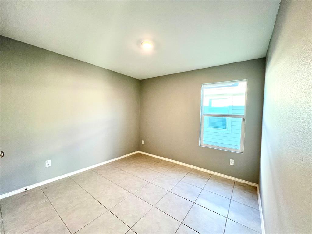 5711 Bristle Leaf Drive Princeton, TX 75407 - Photo 15 of 23 an empty room with a empty space and windows