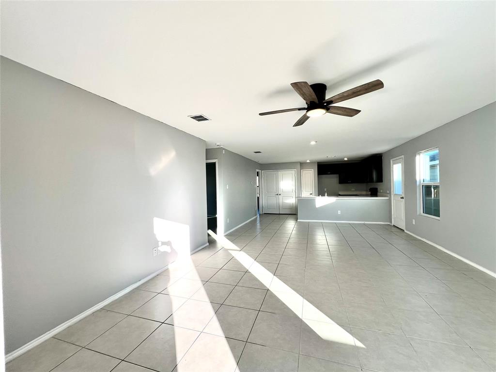 5711 Bristle Leaf Drive Princeton, TX 75407 - Photo 2 of 23 a view of empty room with wooden floor and ceiling fan