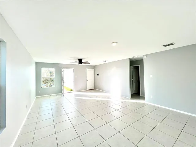 a view of an empty room and window