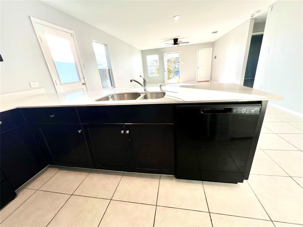 5711 Bristle Leaf Drive Princeton, TX 75407 - Photo 7 of 23 a bathroom with a sink a vanity and mirror