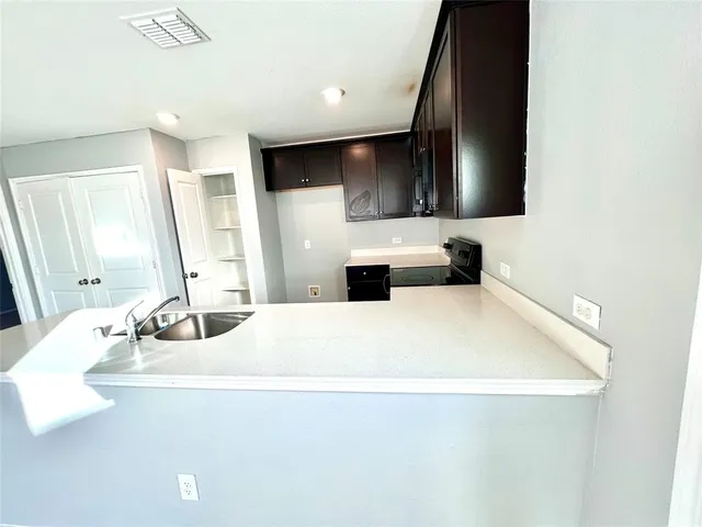 a bathroom with a double vanity sink and mirror
