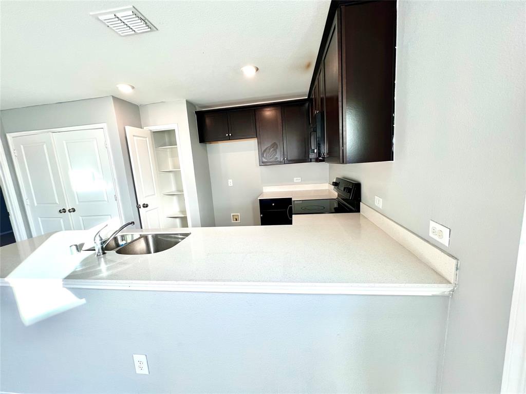 5711 Bristle Leaf Drive Princeton, TX 75407 - Photo 9 of 23 a bathroom with a double vanity sink and mirror