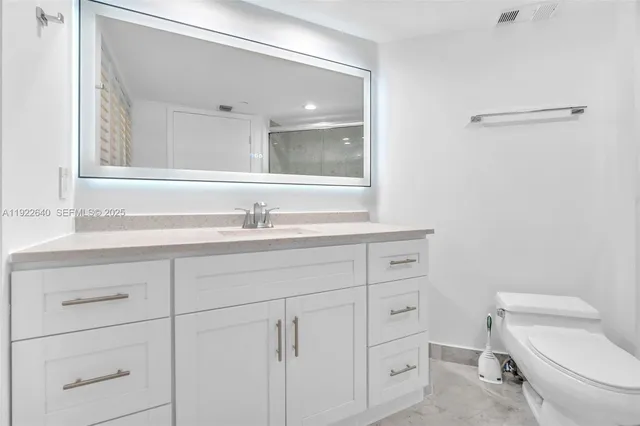 a bathroom with a shower and a toilet