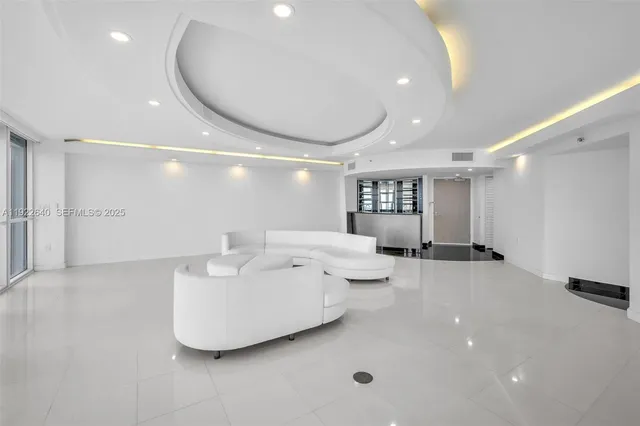 a view of lobby with furniture and large windows