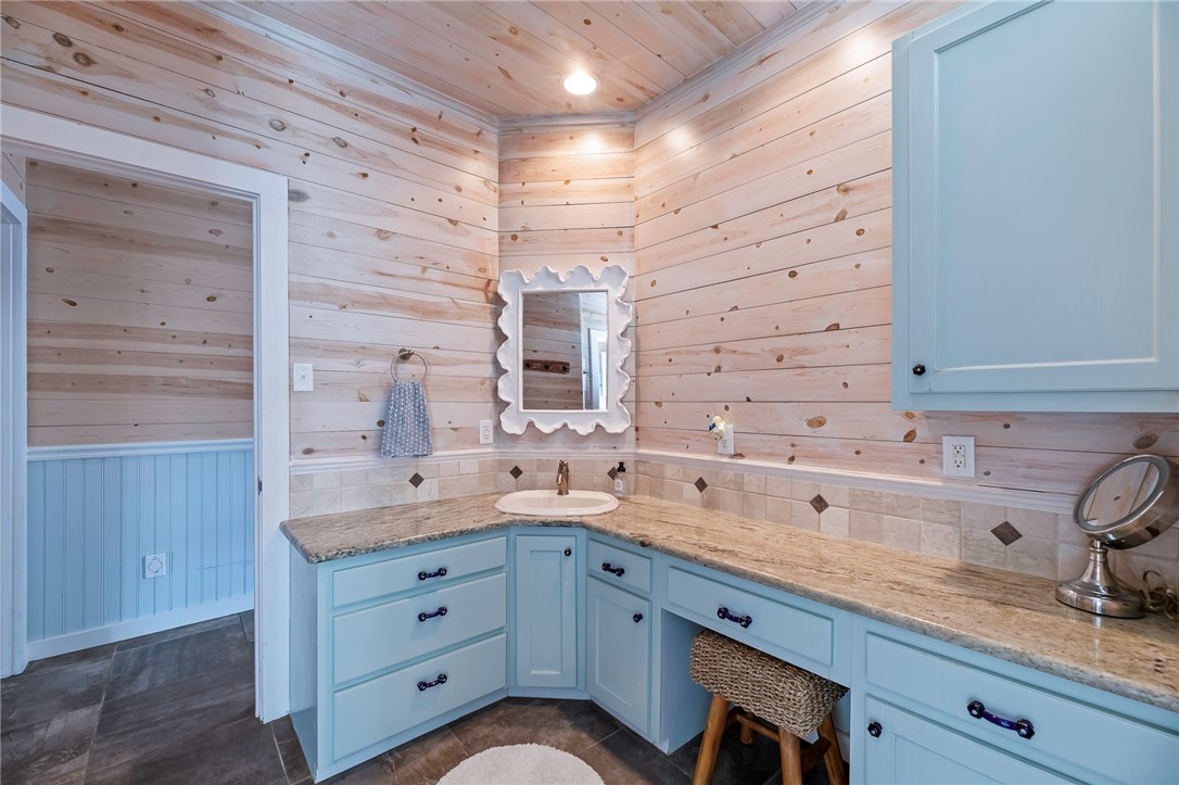 70 Copano Ridge Road Rockport, TX 78382 - Photo 20 of 40 a bathroom with a sink double vanity and shower
