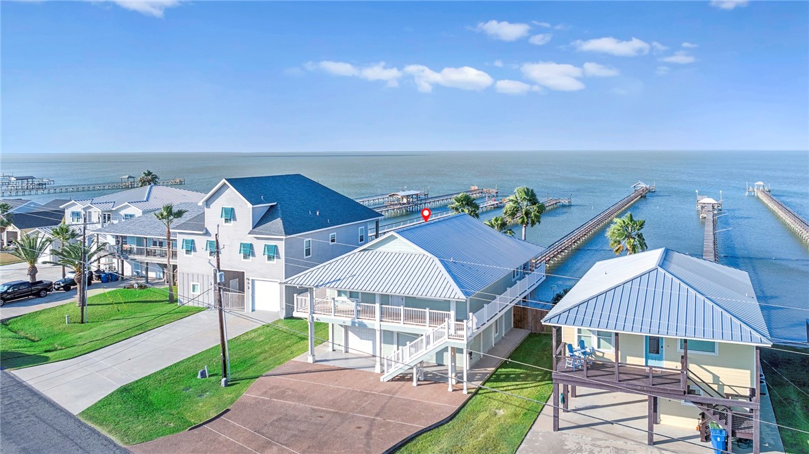 70 Copano Ridge Road Rockport, TX 78382 - Photo 2 of 40 a view of a house with a yard