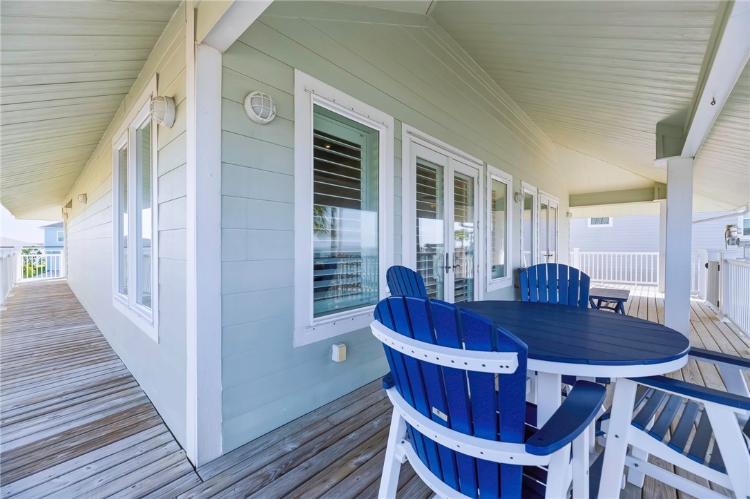 70 Copano Ridge Road Rockport, TX 78382 - Photo 25 of 40 a view of a dining room with furniture window and wooden floor
