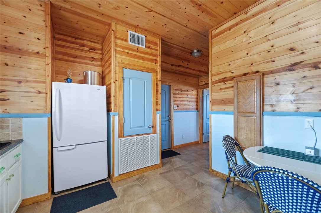 70 Copano Ridge Road Rockport, TX 78382 - Photo 27 of 40 a view of a refrigerator in an empty room