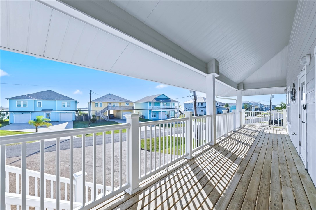 70 Copano Ridge Road Rockport, TX 78382 - Photo 3 of 40 a view of a balcony with wooden floor
