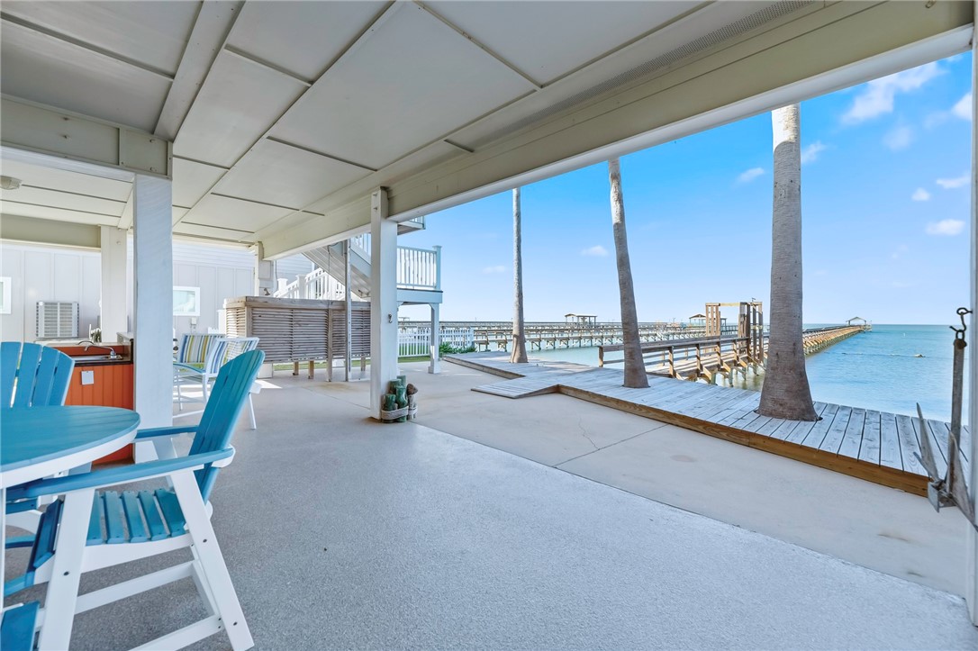 70 Copano Ridge Road Rockport, TX 78382 - Photo 34 of 40 a view of a hallway with furniture and chandelier