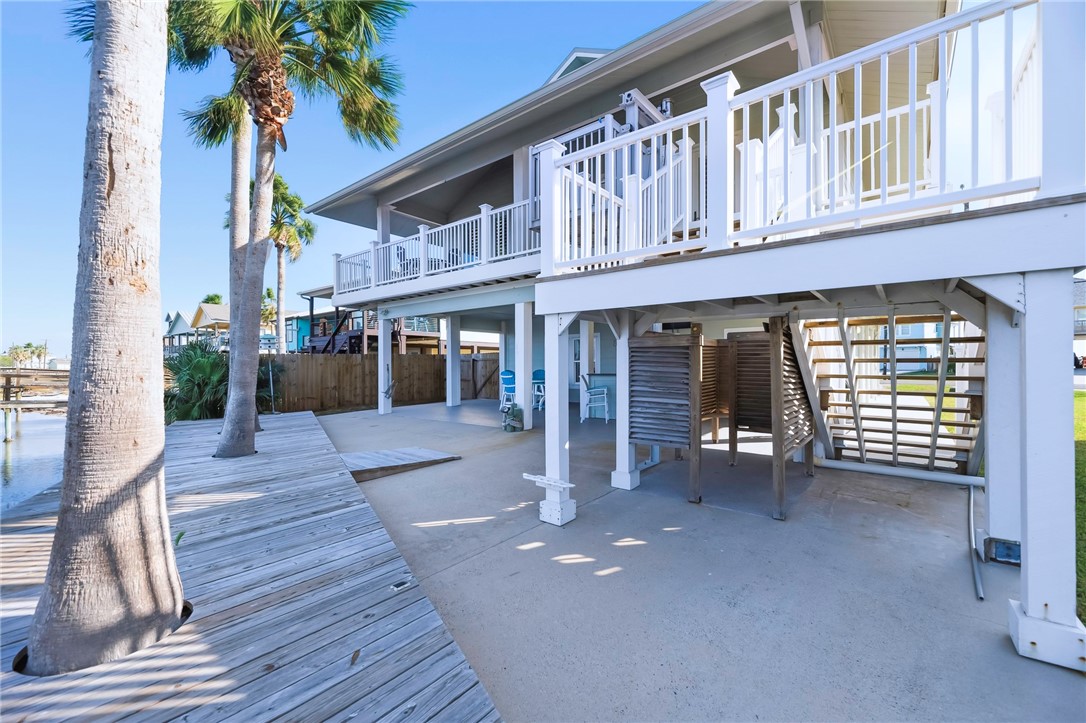 70 Copano Ridge Road Rockport, TX 78382 - Photo 37 of 40 a view of a house with a patio and a yard