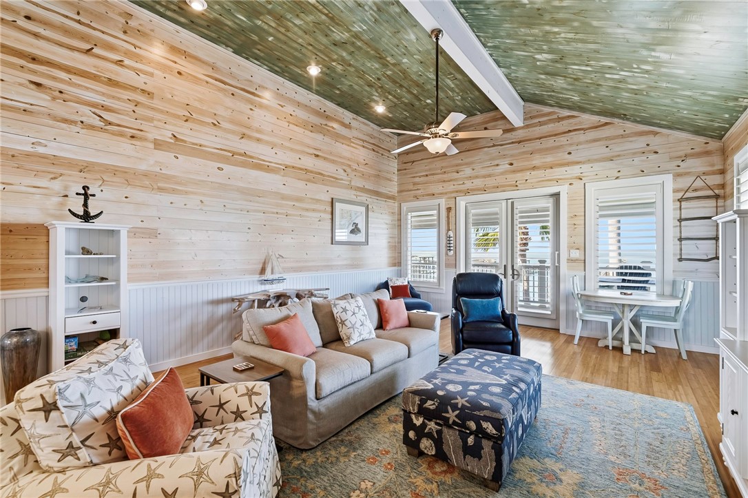 70 Copano Ridge Road Rockport, TX 78382 - Photo 8 of 40 a bedroom with furniture and wooden floor