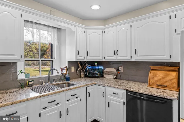 a bedroom with a bed and cabinets