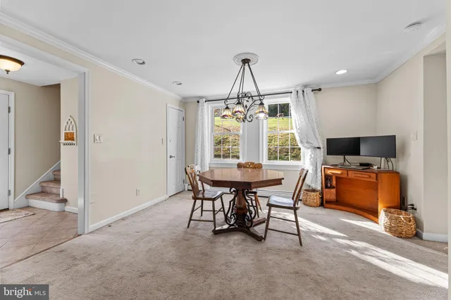 a kitchen with cabinets and window