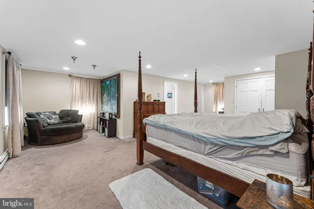 a bedroom with furniture and a chandelier