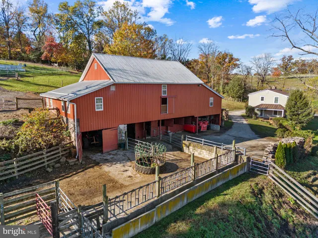a view of a house with roof and sitting area
