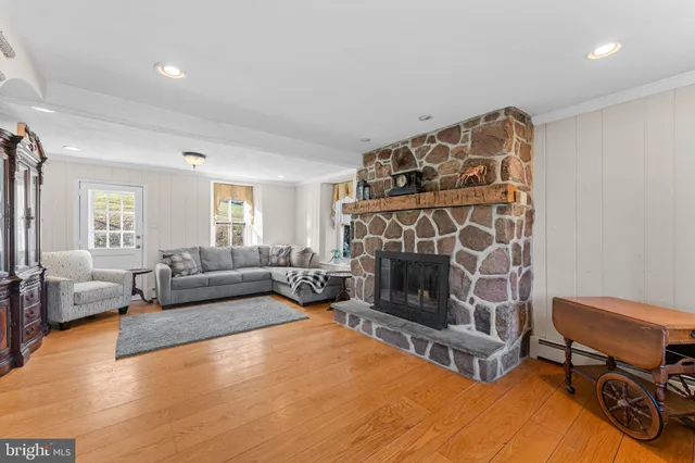 a living room with furniture and stairs