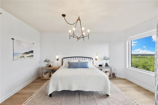 a kitchen with lots of counter top space sink and large mirror