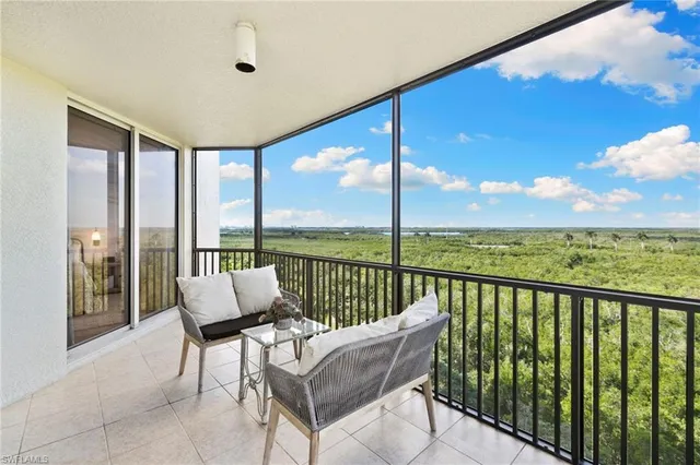 a spacious bathroom with a bathtub shower sink mirror and toilet