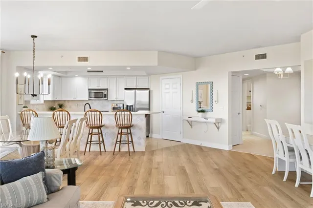 a view of kitchen with cabinets and wooden floor