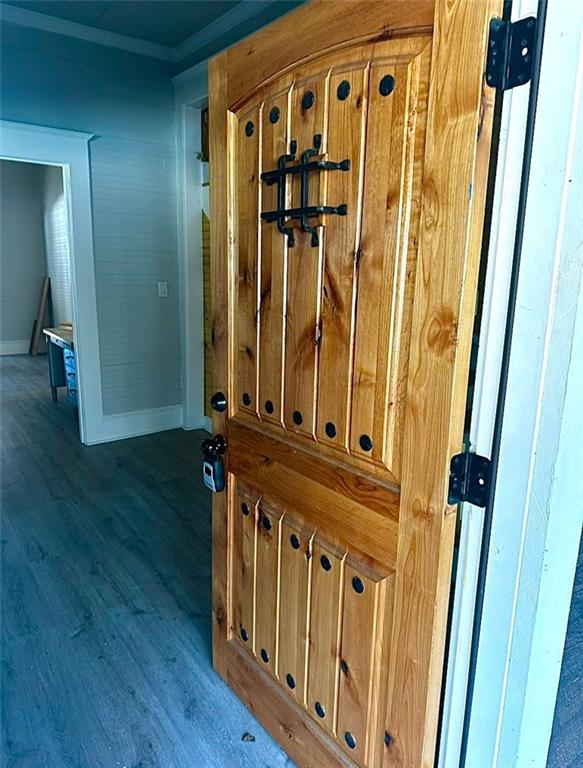 a view of a door with wooden floor