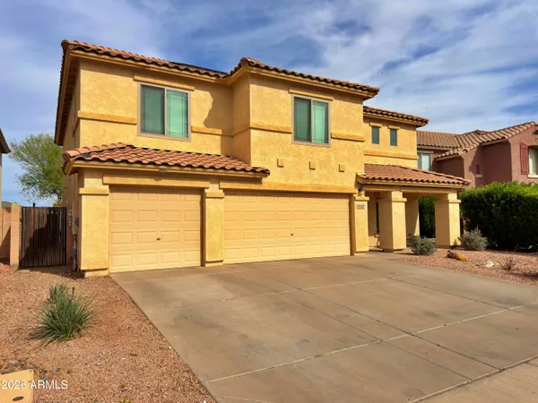 a view of a house with basketball court