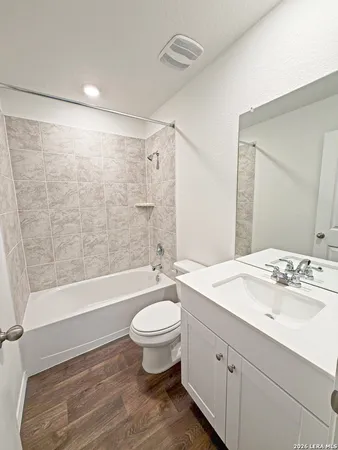 a view of a swimming pool and lounge chairs