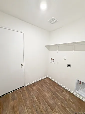 a view of a patio with table and chairs