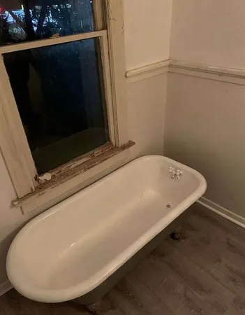 a bath tub sitting in a bathroom