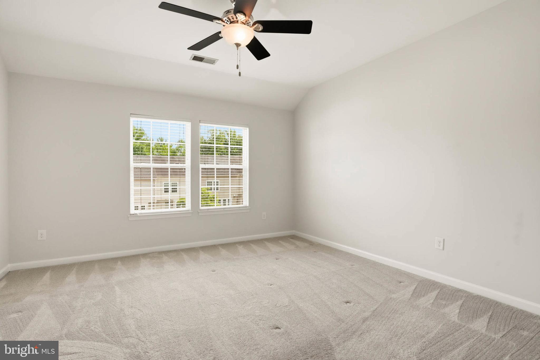 9817 Solar Course Laurel, MD 20723 - Photo 15 of 59 an empty room with a window and a fan