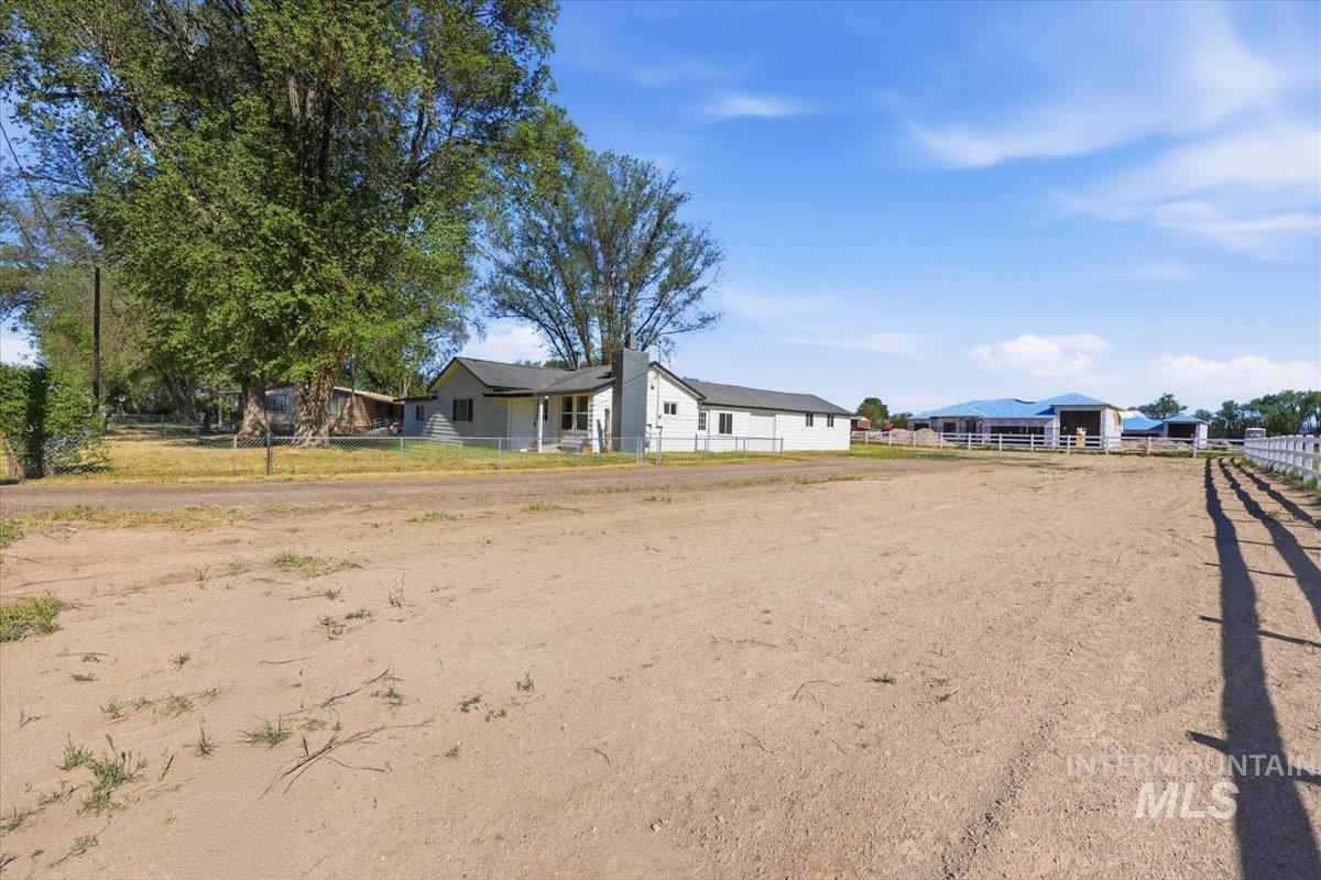 956 Southeast Hamilton Road Mountain Home, ID 83647 - Photo 34 of 34 Expansive open lot with a white picket fence bordering the property