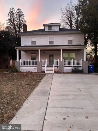 front view of a house with a street