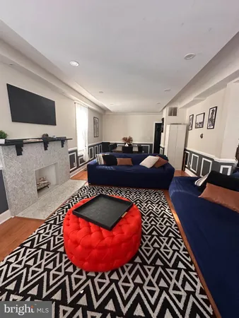 a bed room with furniture and a flat screen tv