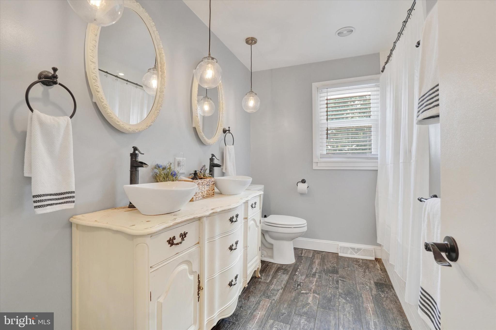 5840 Old Carlisle Road Dover, PA 17315 - Photo 11 of 31 a bathroom with a sink a toilet and a mirror