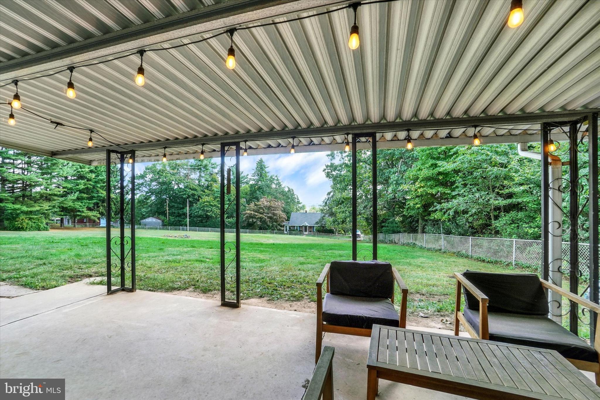 5840 Old Carlisle Road Dover, PA 17315 - Photo 23 of 31 a view of a patio with a table chairs and a backyard