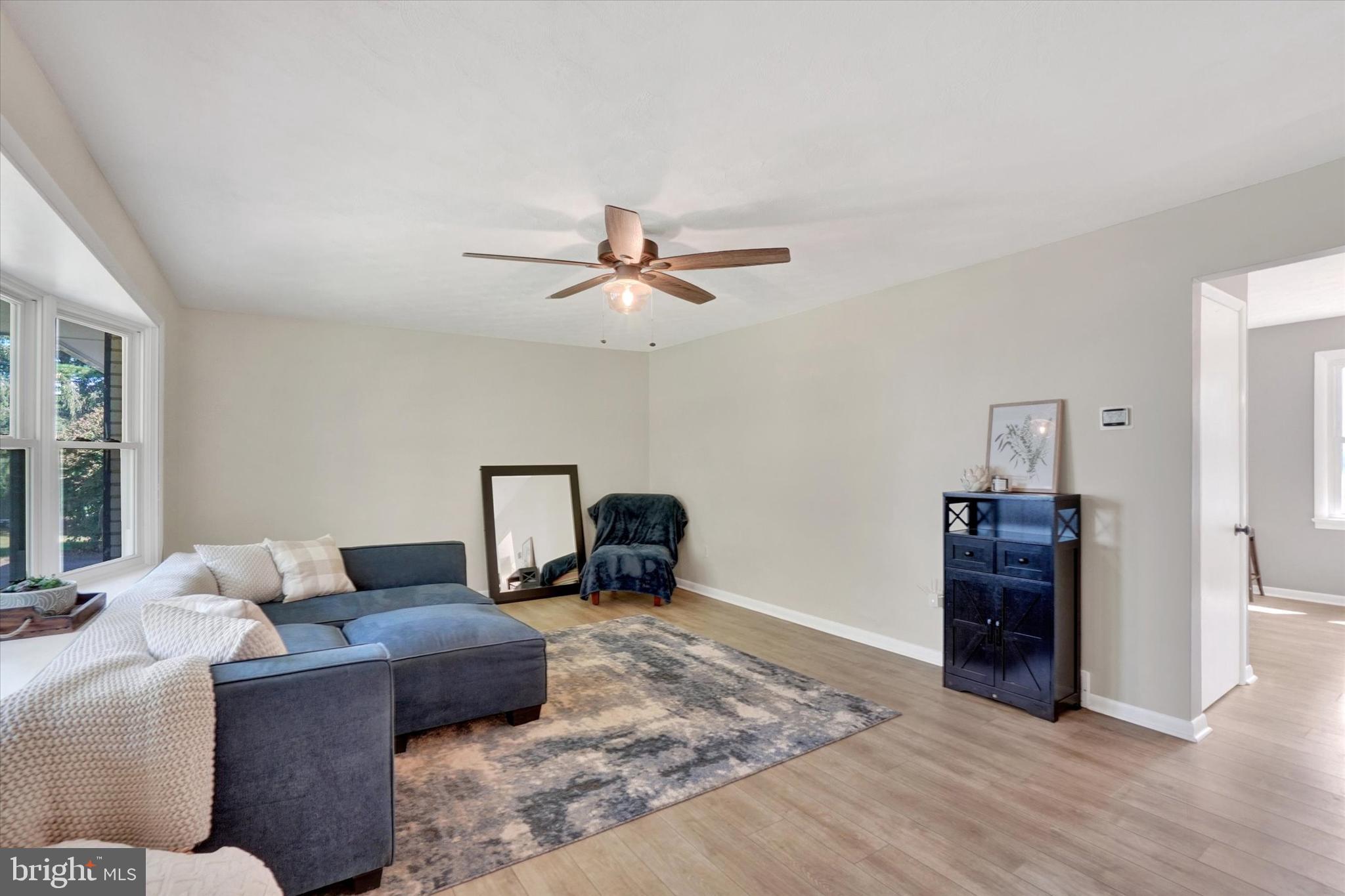 5840 Old Carlisle Road Dover, PA 17315 - Photo 4 of 31 a bedroom with a bed and wooden floor