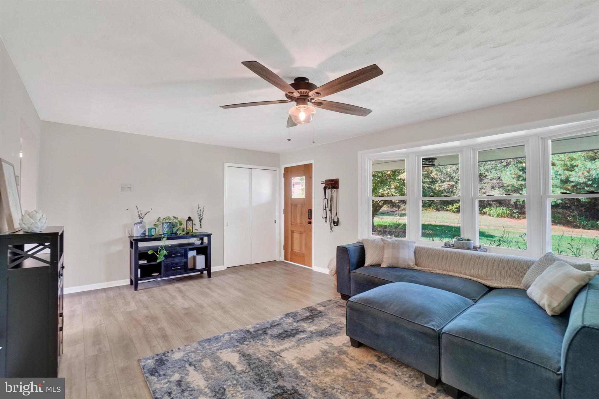 5840 Old Carlisle Road Dover, PA 17315 - Photo 5 of 31 a living room with furniture and a large window with garden view