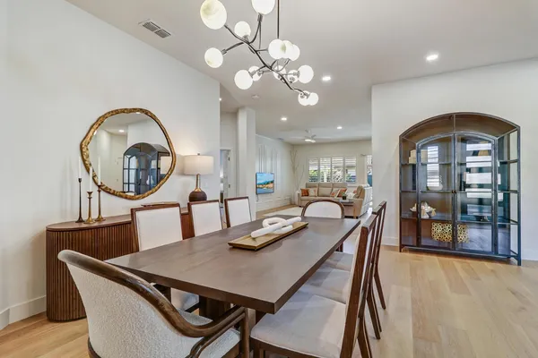 a living room with furniture and a open to kitchen