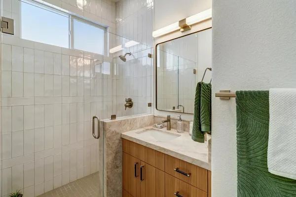 a front view of a house with a garden