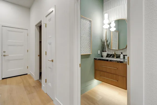 a patio with glass windows and table