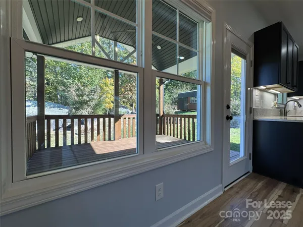 a view of an entryway with a floor to ceiling window