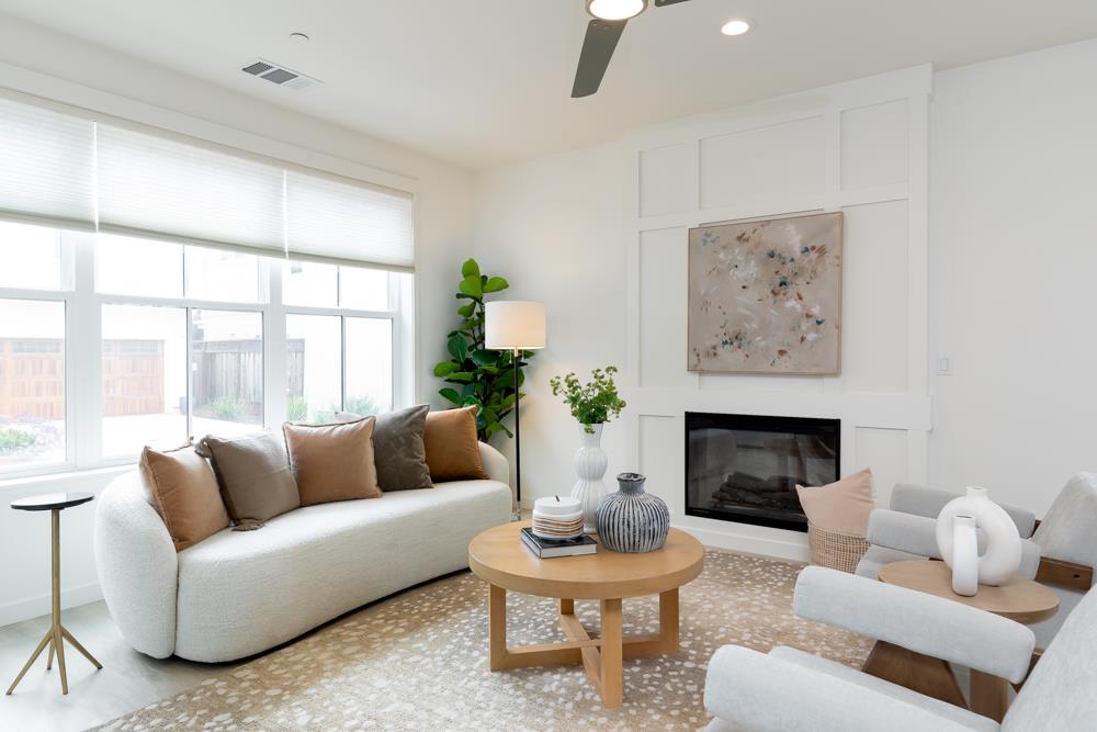 103 Staggi Lane Soquel, CA 95073 - Photo 5 of 35 a living room with furniture a fireplace and a large window