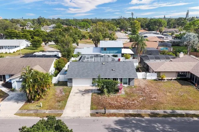 an aerial view of residential building with parking space