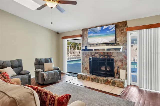 a bedroom with a bed and a mirror on a table