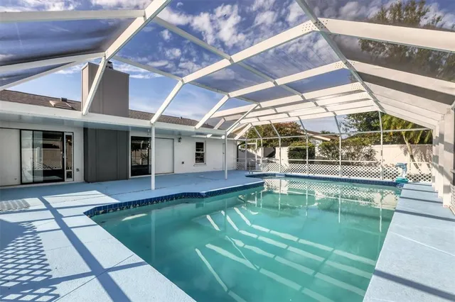 a view of a lake with houses in the back