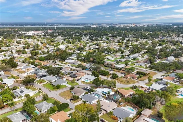 an aerial view of residential building with green space