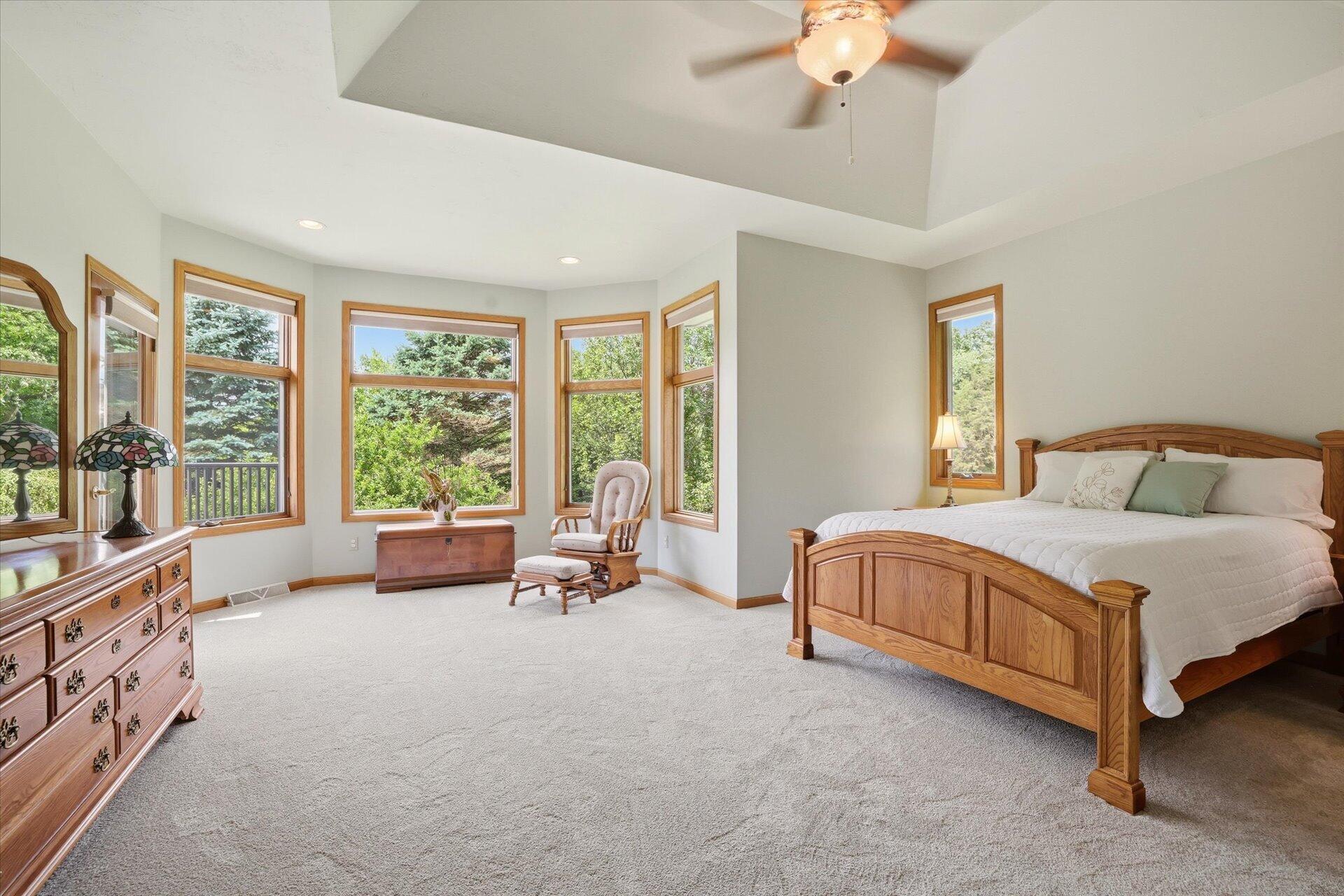 W330-s1417 County Rd C Delafield, WI 53018 - Photo 15 of 39 Spacious primary with sitting area and door to the deck