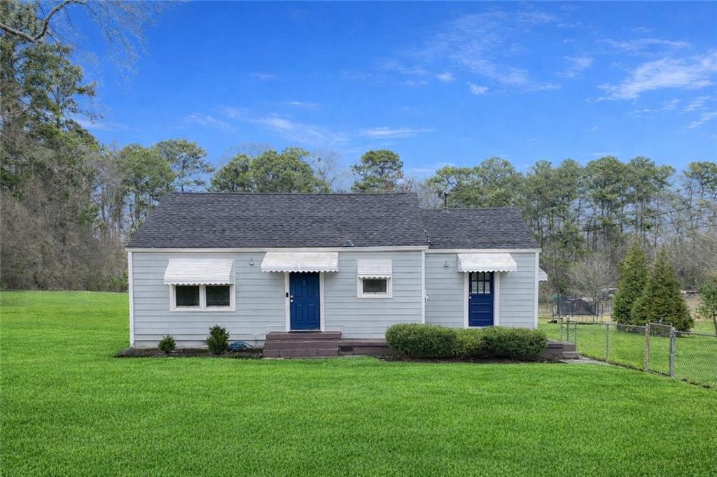 330 Community Drive Mableton, GA 30126 - Photo 2 of 47 a front view of a house with a garden
