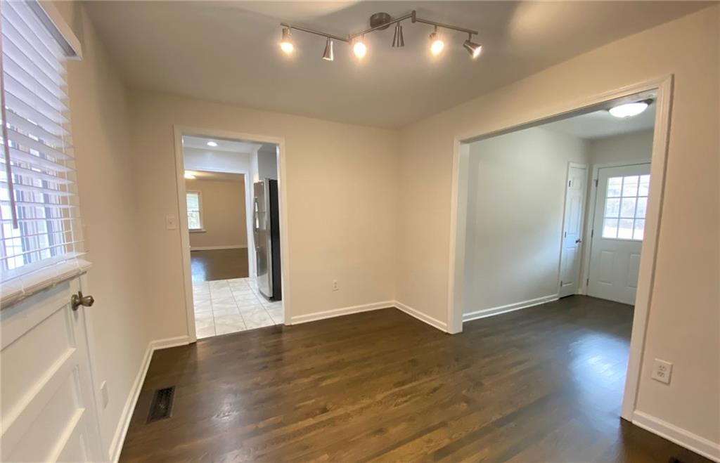 330 Community Drive Mableton, GA 30126 - Photo 25 of 47 a view of a hallway with wooden floor and a living room