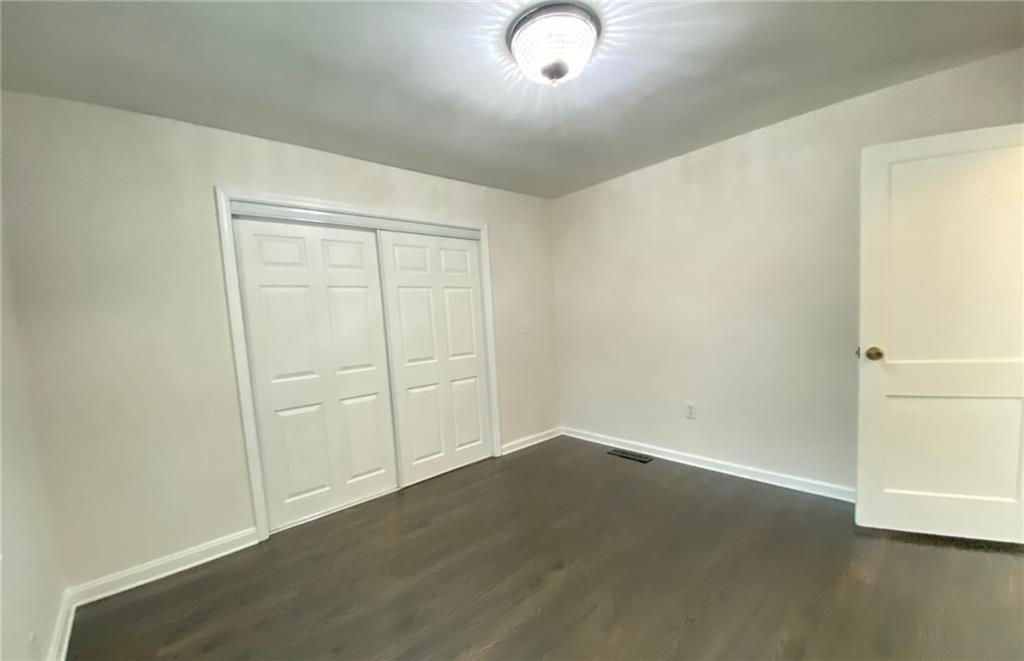 330 Community Drive Mableton, GA 30126 - Photo 29 of 47 an empty room with wooden floor